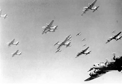 old, black and white photo of bomber planes flying in a clear sky