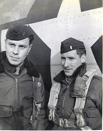 1st Lt. Bill Owen and Lt. Marshall Thixton standing in front of aircraft