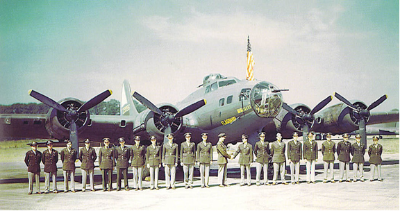 officers of the 92nd bomb group posing formally in front of bomber aircraft