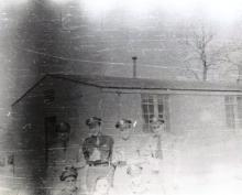 Officers of the 482nd BG with canteens outside their barracks